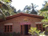 Land with a house for sale from Matale