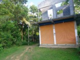 House with a coconut plantation for sale from Weeraketiya