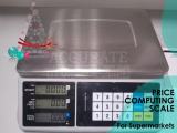 price computing scale with money change function at supplier shop Kampala