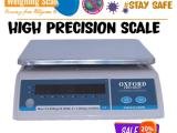 Laboratory precision balance with zero adjustment knob