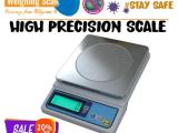 Laboratory precision balance with zero adjustment knob